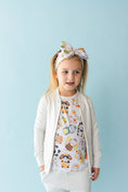 Load image into Gallery viewer, A young girl poses against a light blue background, wearing the Jammie Session Meowster of Disguise Solid Kids' Jacket (runs small, please size up) over a cat-themed shirt, paired with a matching knotted headband and light pants.