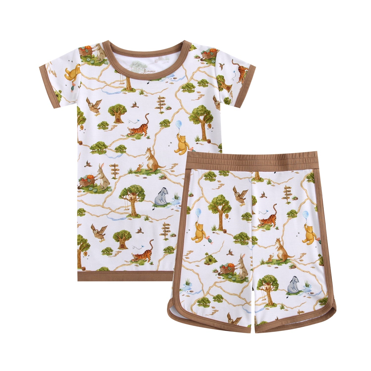 The Oh Bother, It's Bedtime Short Pajama Set by Jammie Session features buttery soft, hypoallergenic bamboo with a nature and animal print—trees, birds, and animals—on white fabric with brown trim.